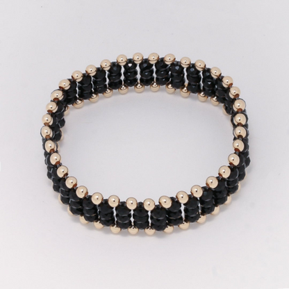 Pulsera hilo elástico con cristal claro u oscuro y bola oro laminado 14K - Línea Adamoon